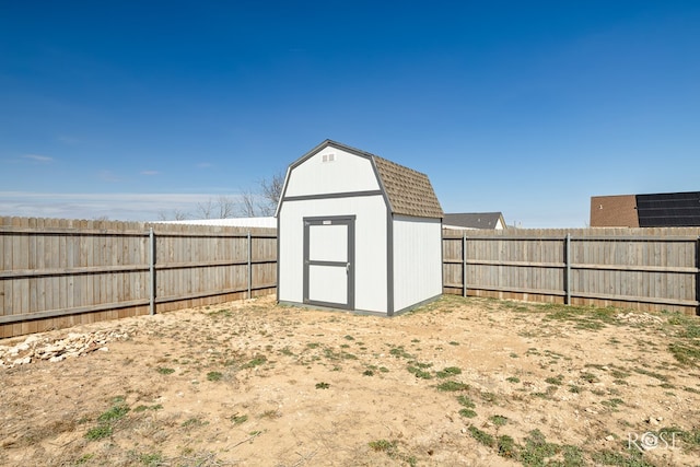 view of shed with a fenced backyard