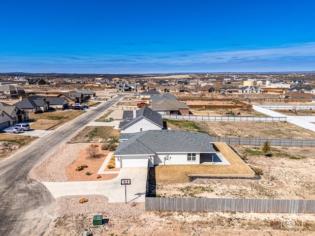 birds eye view of property with a residential view