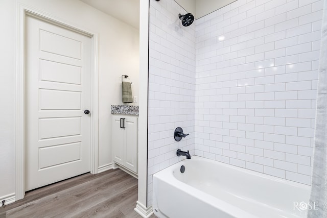 bathroom with shower / bathtub combination and wood finished floors