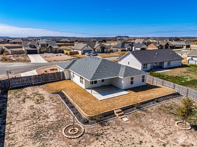 birds eye view of property with a residential view