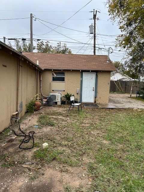 back of property featuring a patio and ac unit