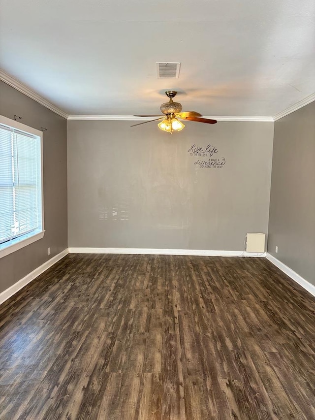 spare room featuring dark wood-type flooring, ceiling fan, and ornamental molding