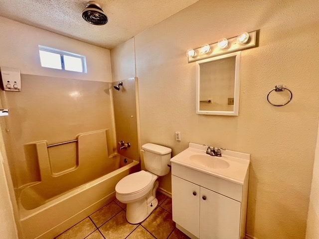 721 Spaulding St, San Angelo, TX 76903 - full bath with vanity, shower / bath combination, tile patterned floors, and a textured ceiling