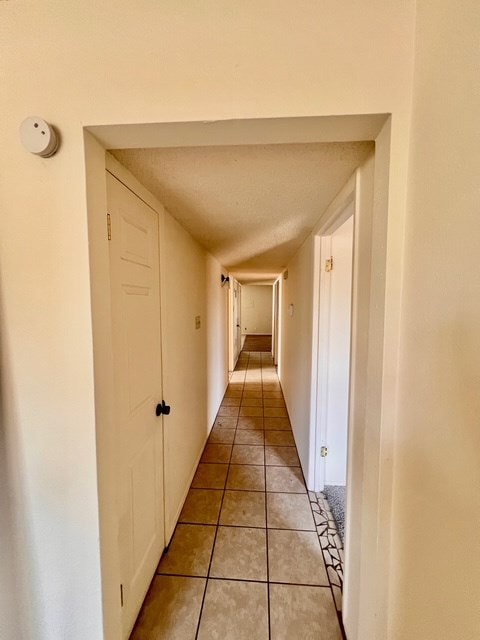 721 Spaulding St, San Angelo, TX 76903 - corridor featuring light tile patterned floors