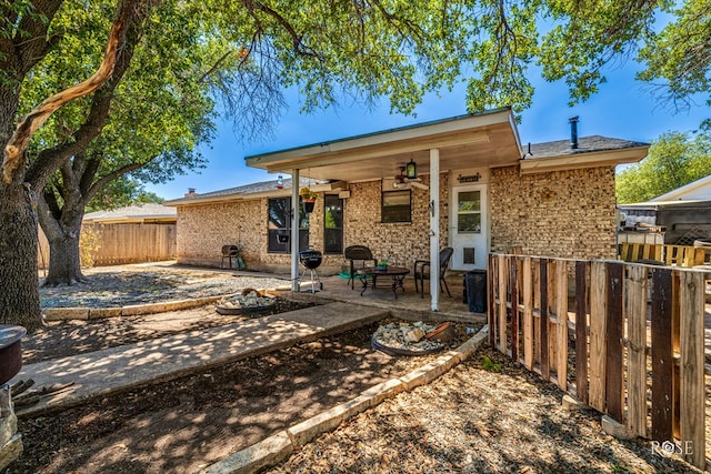 back of house featuring ceiling fan and a patio area