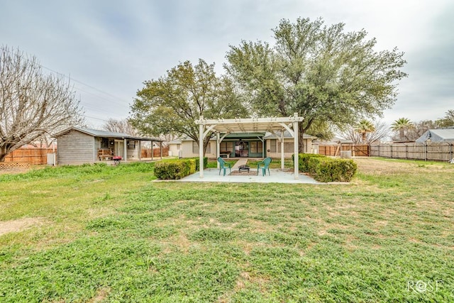 view of yard with a patio, a fenced backyard, and a pergola