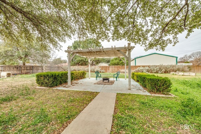 view of yard with an outdoor fire pit, a patio, fence, and a pergola