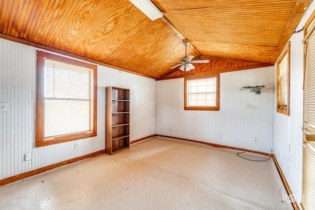 unfurnished room with wooden ceiling, baseboards, vaulted ceiling, and a ceiling fan