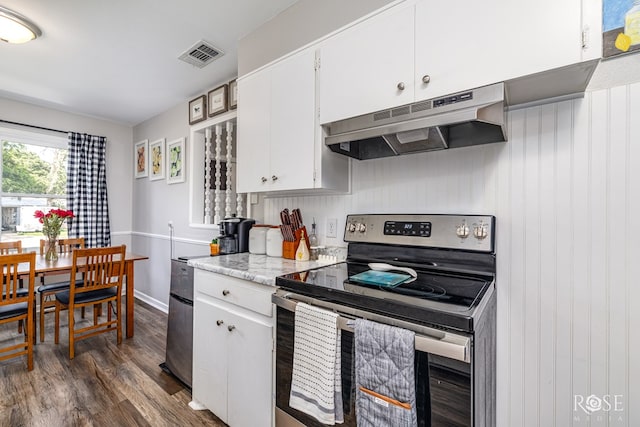 117 Windham St, San Angelo, TX 76903 - kitchen with electric range, under cabinet range hood, dark wood-style flooring, and white cabinets