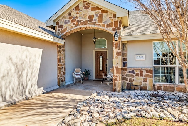 doorway to property with a patio area