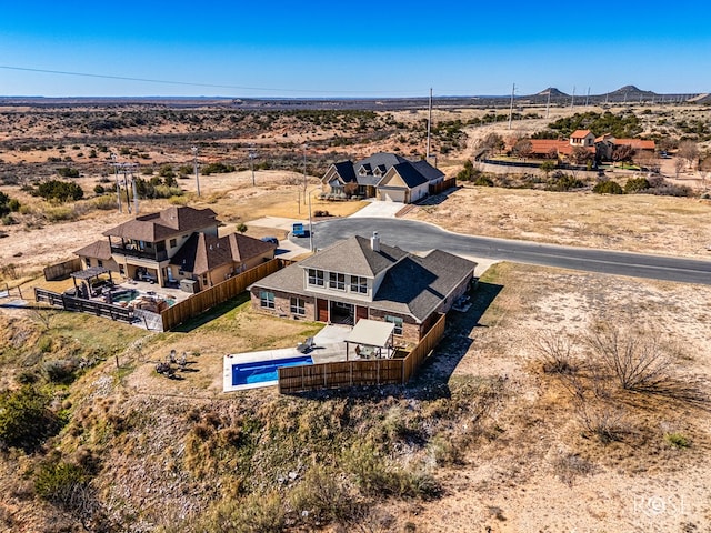 birds eye view of property featuring a mountain view