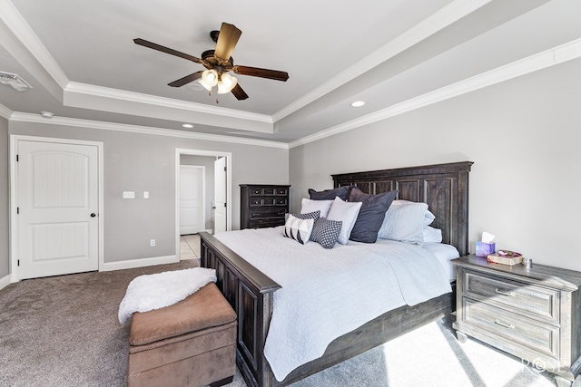 carpeted bedroom featuring a raised ceiling, crown molding, and ceiling fan