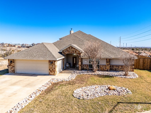 ranch-style house featuring a garage and a front lawn