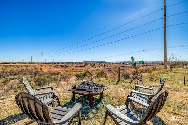 exterior space featuring a fire pit and a rural view