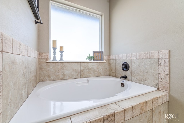 bathroom with a relaxing tiled tub