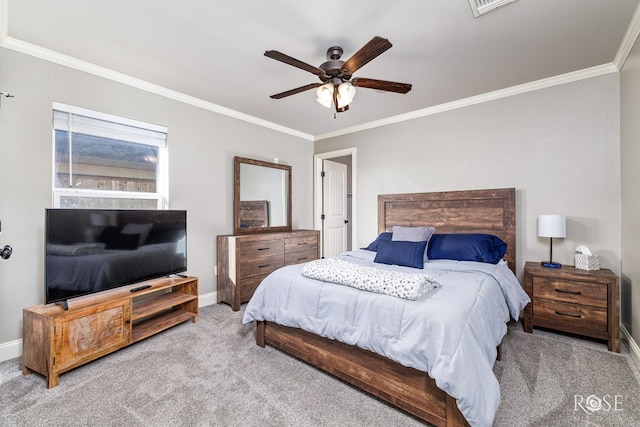 bedroom featuring ornamental molding, light colored carpet, and ceiling fan