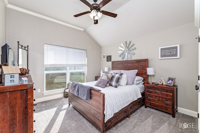 carpeted bedroom with ornamental molding, lofted ceiling, and ceiling fan