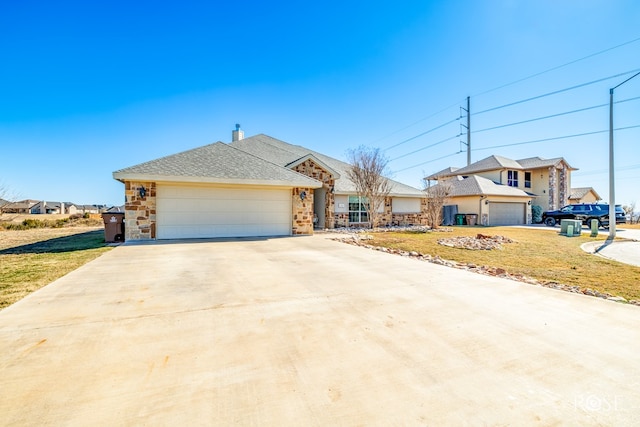 view of front of property with a garage and a front lawn