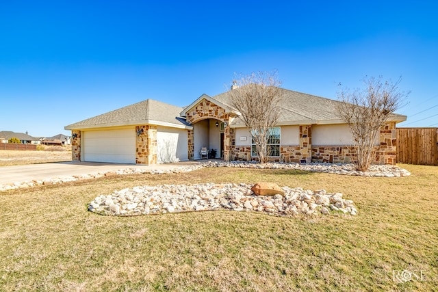 ranch-style home with a garage and a front yard