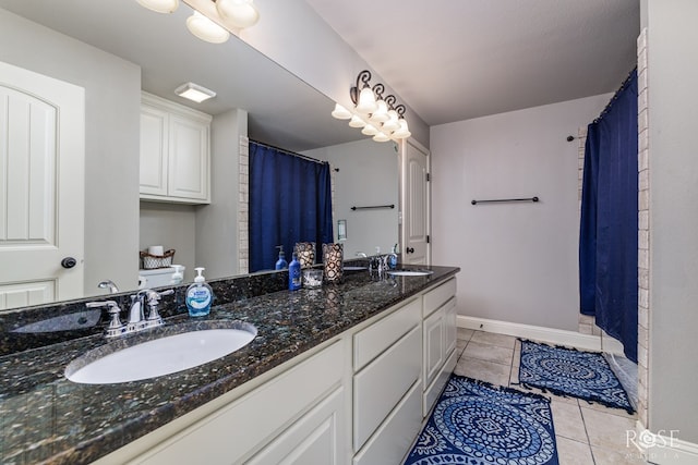 bathroom featuring a shower with curtain, vanity, and tile patterned flooring