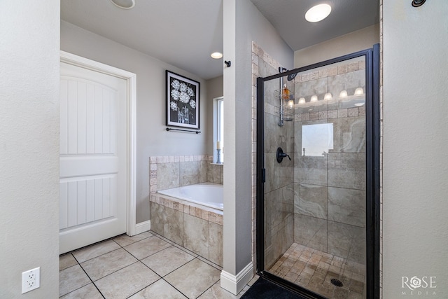 bathroom featuring separate shower and tub and tile patterned flooring