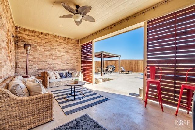 view of patio featuring ceiling fan and an outdoor living space