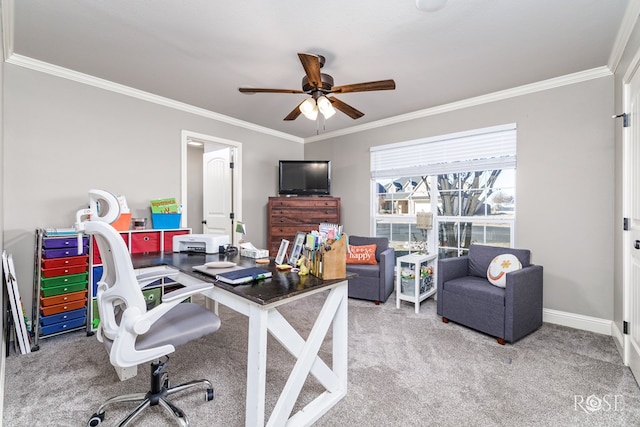 carpeted home office featuring ornamental molding and ceiling fan