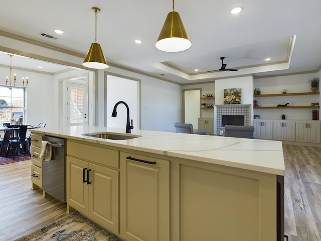 3608 Clearview Dr, San Angelo, TX 76904 - kitchen with stainless steel dishwasher, ceiling fan, crown molding, light wood finished floors, and open floor plan