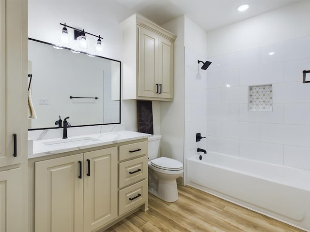 3608 Clearview Dr, San Angelo, TX 76904 - full bath featuring vanity, wood finished floors, and shower / bath combination