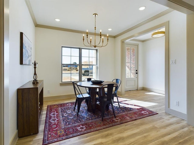 3608 Clearview Dr, San Angelo, TX 76904 - dining space with crown molding, a chandelier, light wood-style flooring, and recessed lighting