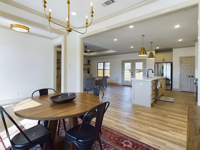 3608 Clearview Dr, San Angelo, TX 76904 - dining room featuring ornamental molding, light wood-type flooring, a chandelier, recessed lighting, and french doors