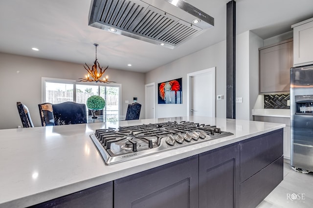4992 Silver Creek Pass, San Angelo, TX 76904 - kitchen featuring custom range hood, stainless steel gas cooktop, gray cabinetry, a chandelier, and recessed lighting