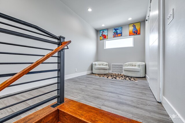 4992 Silver Creek Pass, San Angelo, TX 76904 - living area with wood finished floors, stairs, and recessed lighting