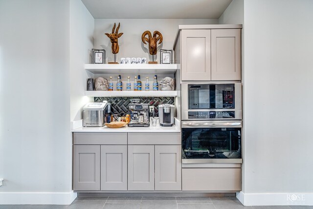 4992 Silver Creek Pass, San Angelo, TX 76904 - bar with stainless steel oven and black microwave