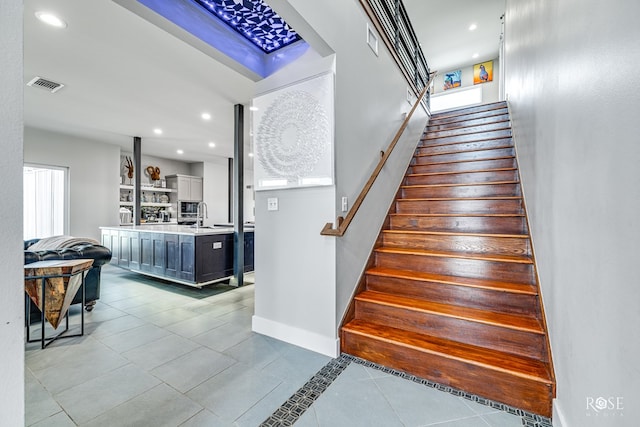 4992 Silver Creek Pass, San Angelo, TX 76904 - staircase featuring tile patterned floors and recessed lighting