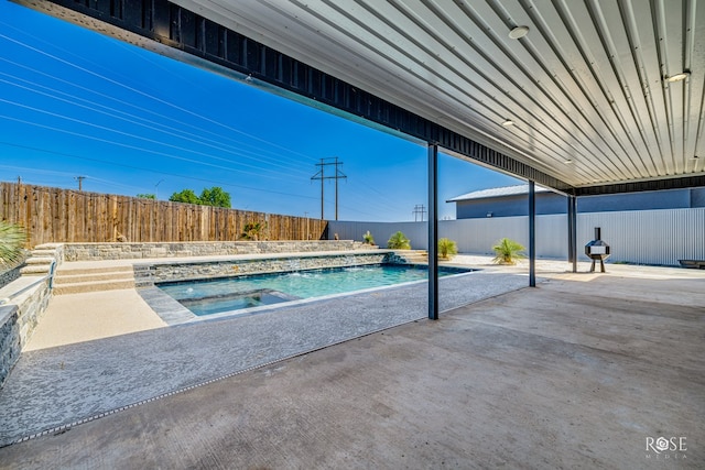 4992 Silver Creek Pass, San Angelo, TX 76904 - view of swimming pool featuring a patio, a fenced backyard, and an in-ground hot tub