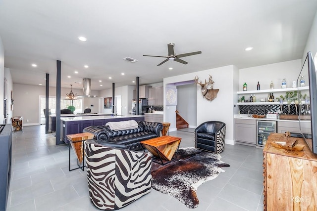 4992 Silver Creek Pass, San Angelo, TX 76904 - tiled living room with a dry bar, beverage cooler, stairway, a ceiling fan, and recessed lighting