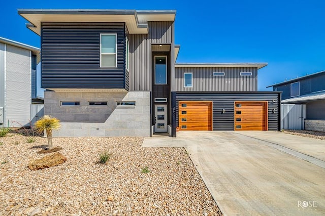 4992 Silver Creek Pass, San Angelo, TX 76904 - contemporary house with concrete driveway and an attached garage
