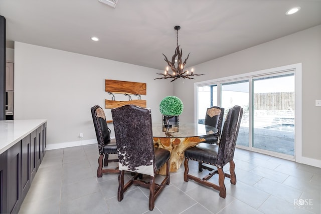 4992 Silver Creek Pass, San Angelo, TX 76904 - dining area featuring a chandelier, recessed lighting, and light tile patterned floors