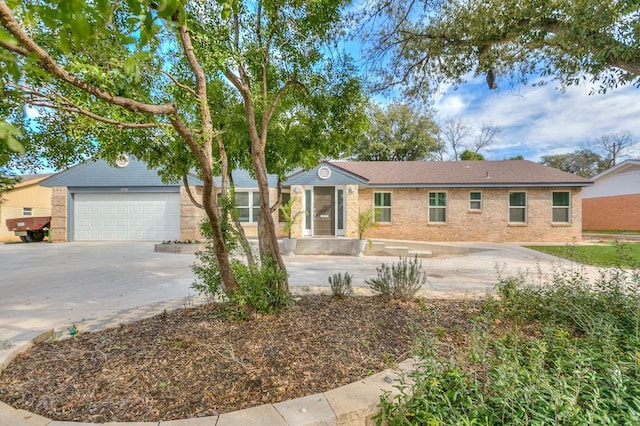 ranch-style house featuring a garage