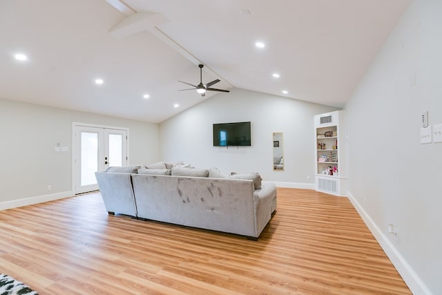 unfurnished living room featuring lofted ceiling with beams, light hardwood / wood-style floors, french doors, and ceiling fan