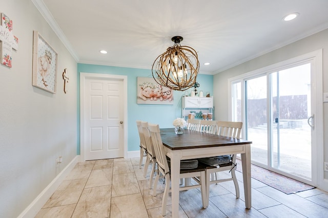 dining area with crown molding and an inviting chandelier