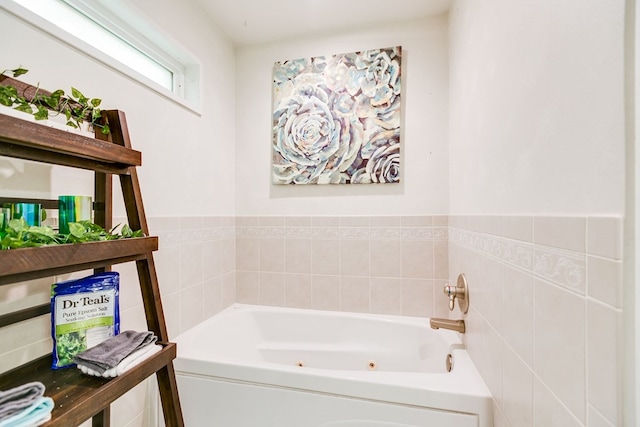 bathroom with a tub to relax in