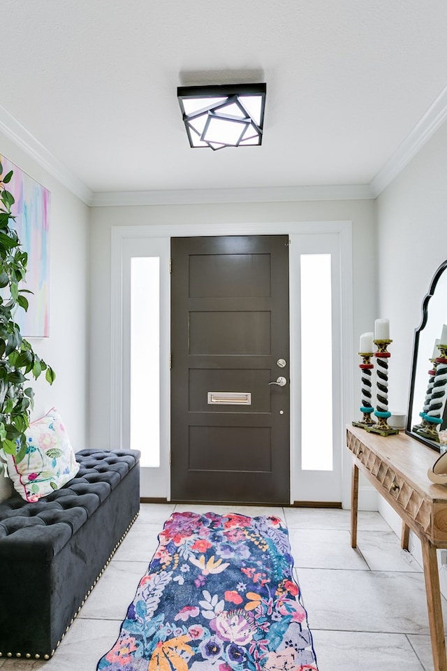 entrance foyer featuring crown molding