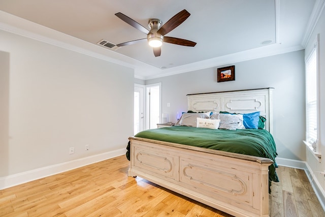 bedroom featuring ornamental molding, ceiling fan, and light wood-type flooring