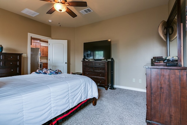 7805 Elk Run, San Angelo, TX 76901 - bedroom featuring carpet, freestanding refrigerator, baseboards, and a ceiling fan