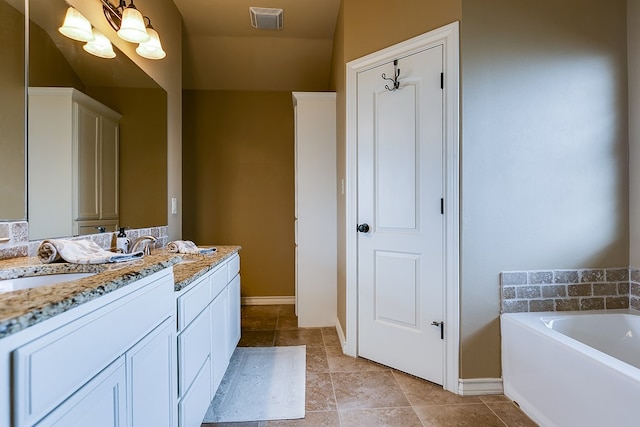7805 Elk Run, San Angelo, TX 76901 - full bath with baseboards, a bath, and vanity