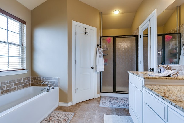 7805 Elk Run, San Angelo, TX 76901 - bathroom with plenty of natural light, a stall shower, vanity, and a garden tub