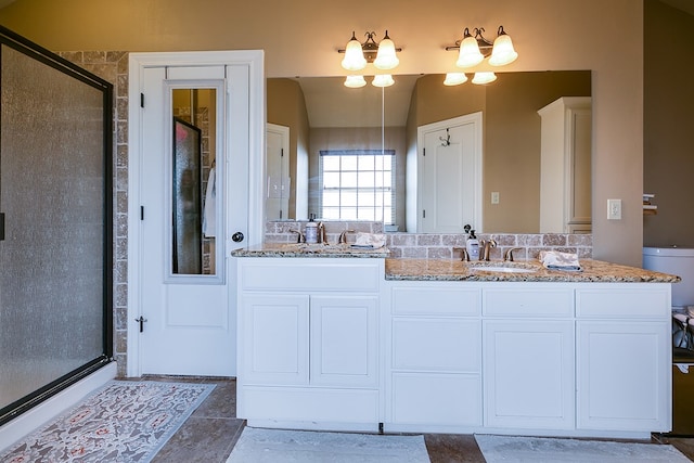 7805 Elk Run, San Angelo, TX 76901 - full bathroom with a stall shower and double vanity