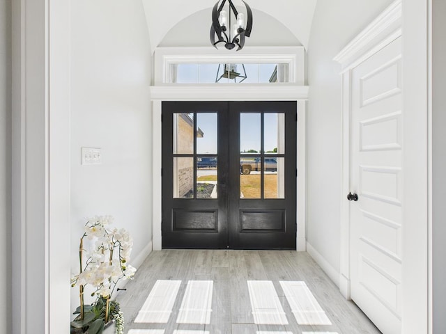 3725 Silver Spur Dr, San Angelo, TX 76904 - foyer with baseboards, a chandelier, french doors, and wood finished floors